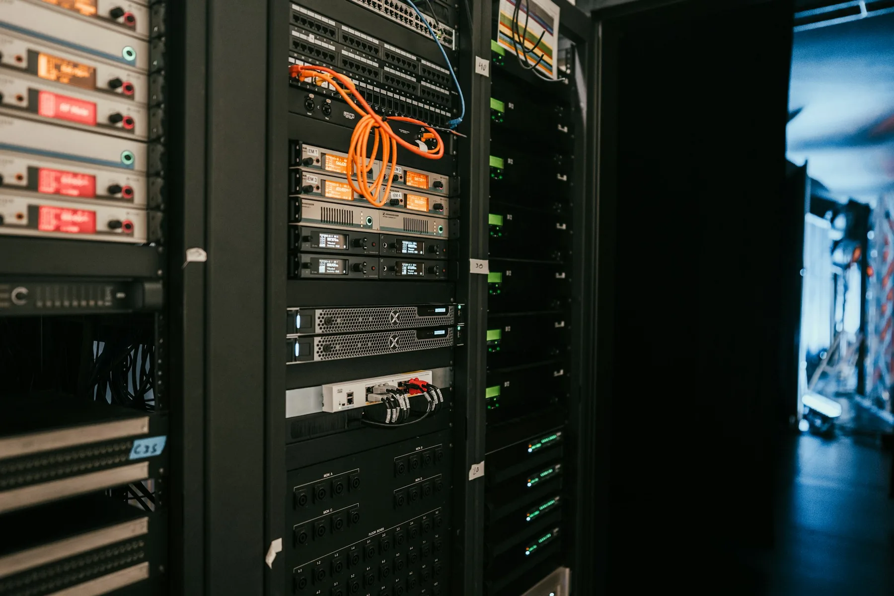 Rows of illuminated servers inside a data center